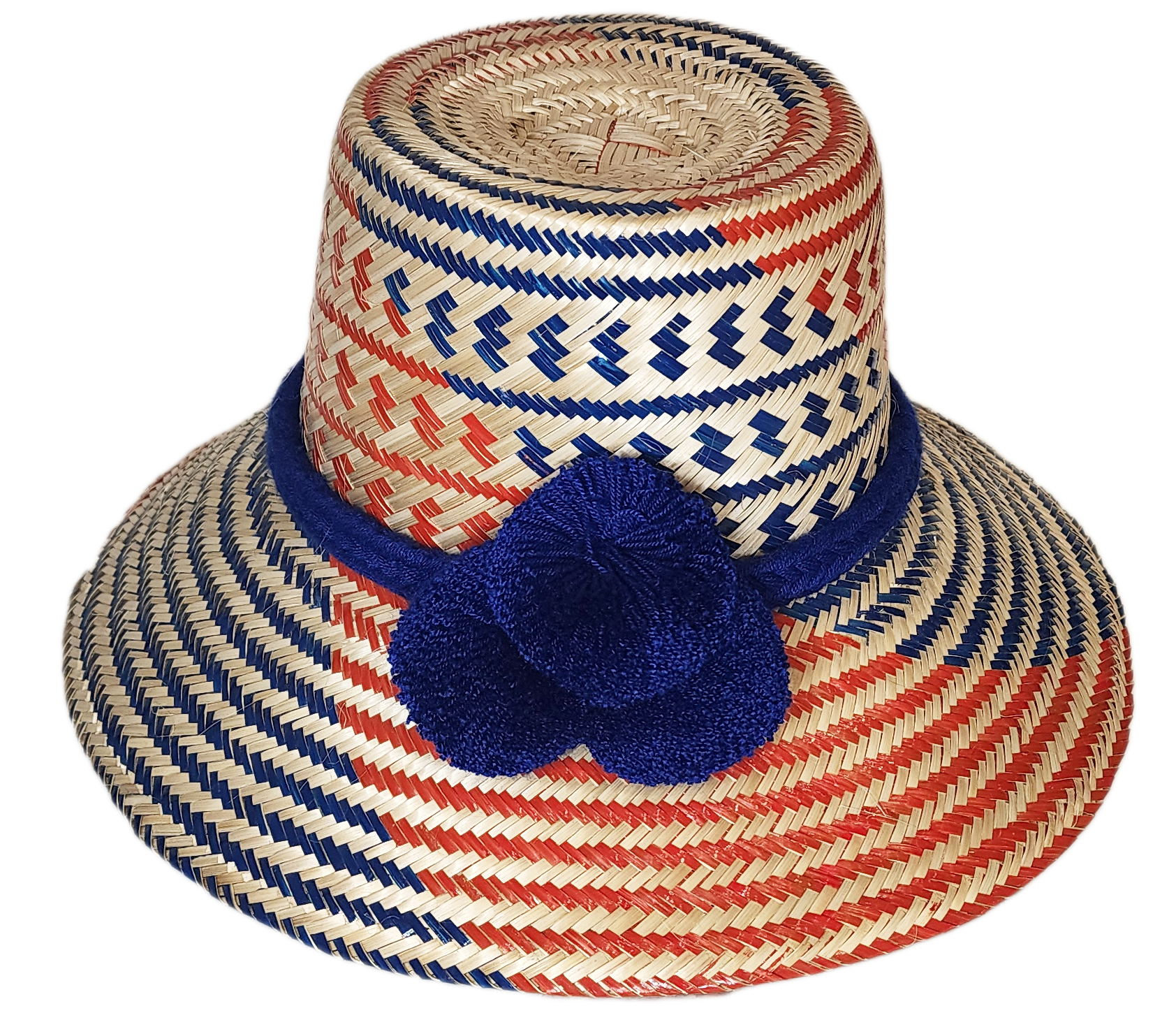 "Colorful handmade Wuitusu Wayuu hat crafted from Iraca palm fibers, adorned with symbolic pompoms, offering versatile stylin