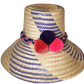 "Colorful handmade Wuitusu Wayuu hat crafted from Iraca palm fiber, adorned with culturally significant pompoms, adjustable f