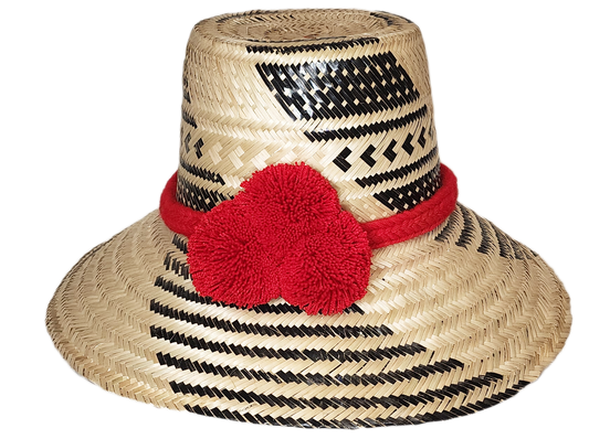 "Colorful handmade Wuitusu Wayuu Hat crafted from Iraca palm fibers, adorned with cultural pompoms for style and prosperity."