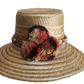 "Colorful handmade Wuitusu Wayuu hat crafted from Iraca palm fibers, adorned with culturally significant pompoms."