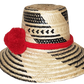 "Colorful handmade Wuitusu Wayuu Hat crafted from Iraca palm fibers, adorned with cultural pompoms for style and prosperity."