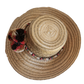 "Colorful handmade Wuitusu Wayuu hat crafted from Iraca palm fibers, adorned with culturally significant pompoms."