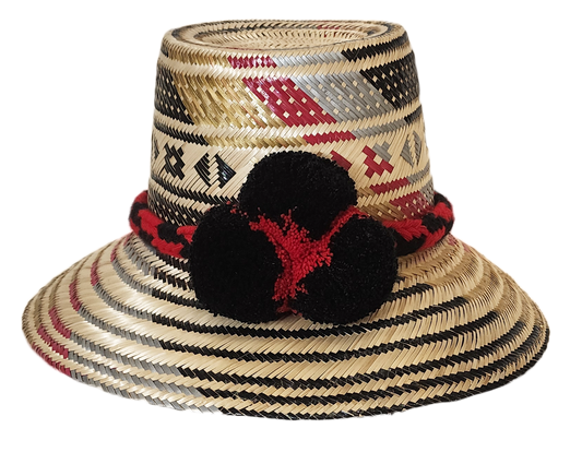 "Colorful, handwoven Wayuu hat from Wuitusu, adorned with culturally significant pompoms, offering flexible styling and sun p