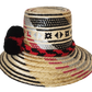 "Colorful, handwoven Wayuu hat from Wuitusu, adorned with culturally significant pompoms, offering flexible styling and sun p