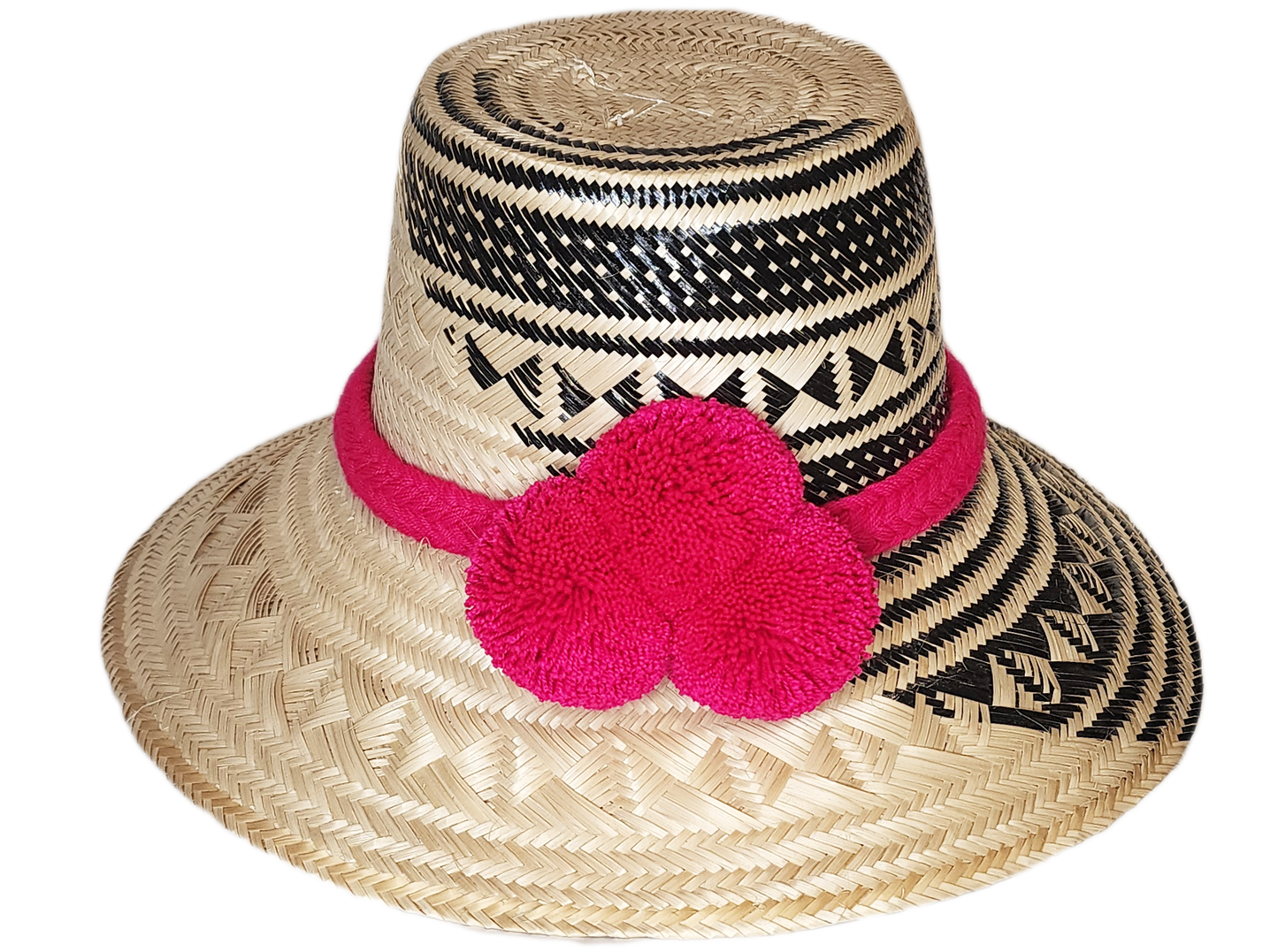 "Colorful handwoven Wayuu hat from Wuitusu, crafted with Iraca palm fibers and decorated with cultural pompoms."