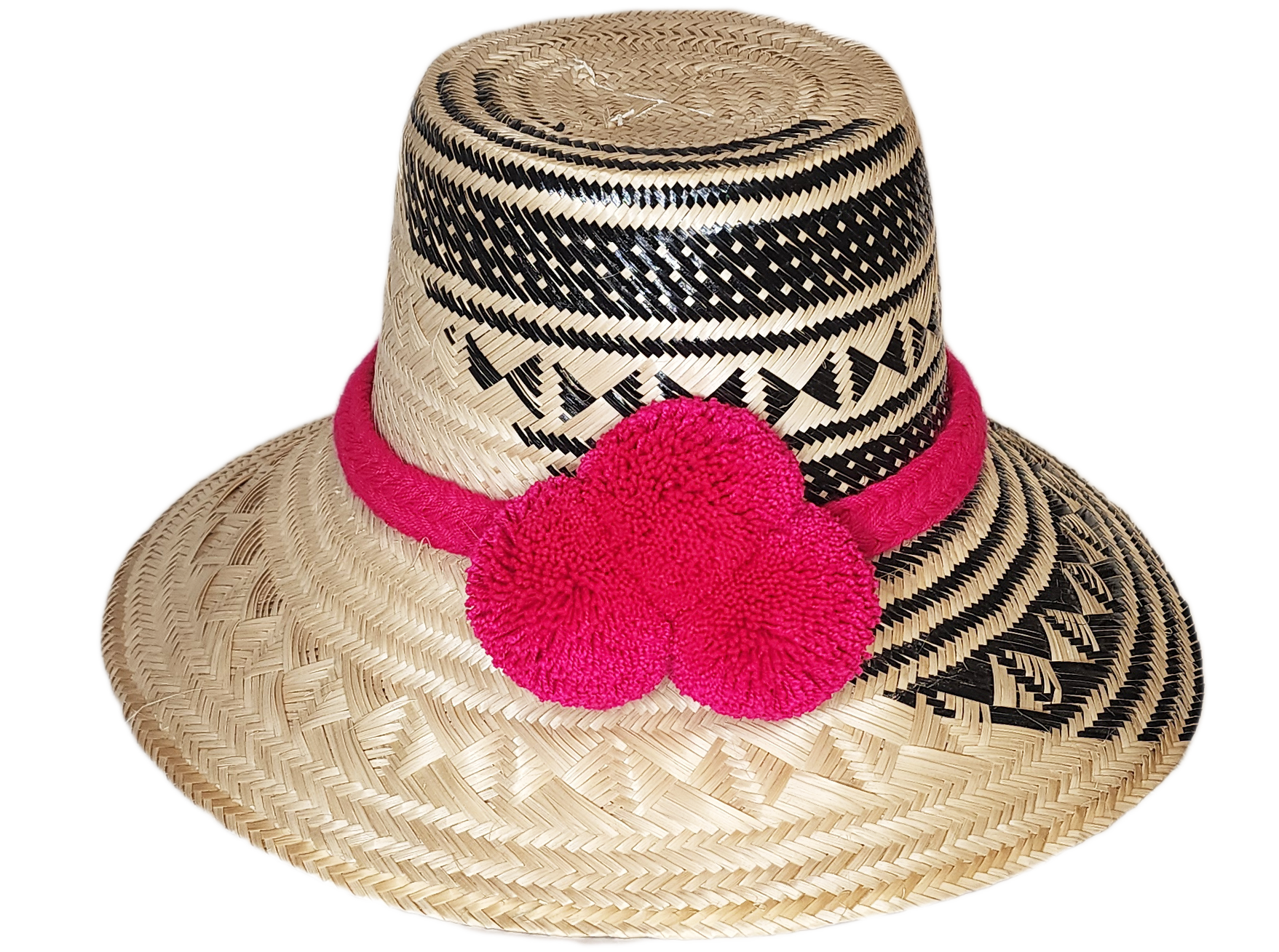 "Colorful handwoven Wayuu hat from Wuitusu, crafted with Iraca palm fibers and decorated with cultural pompoms."
