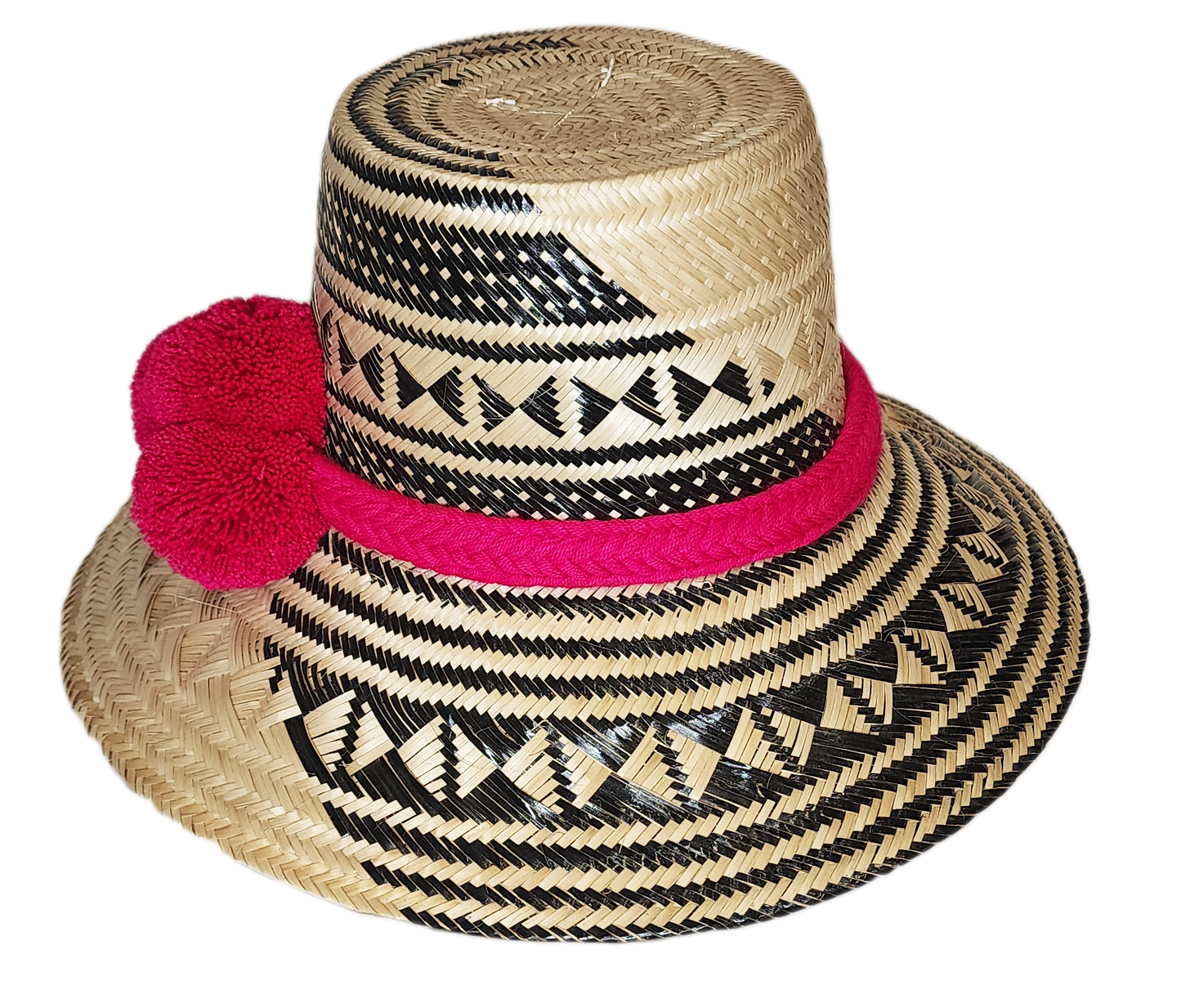 "Colorful handwoven Wayuu hat from Wuitusu, crafted with Iraca palm fibers and decorated with cultural pompoms."