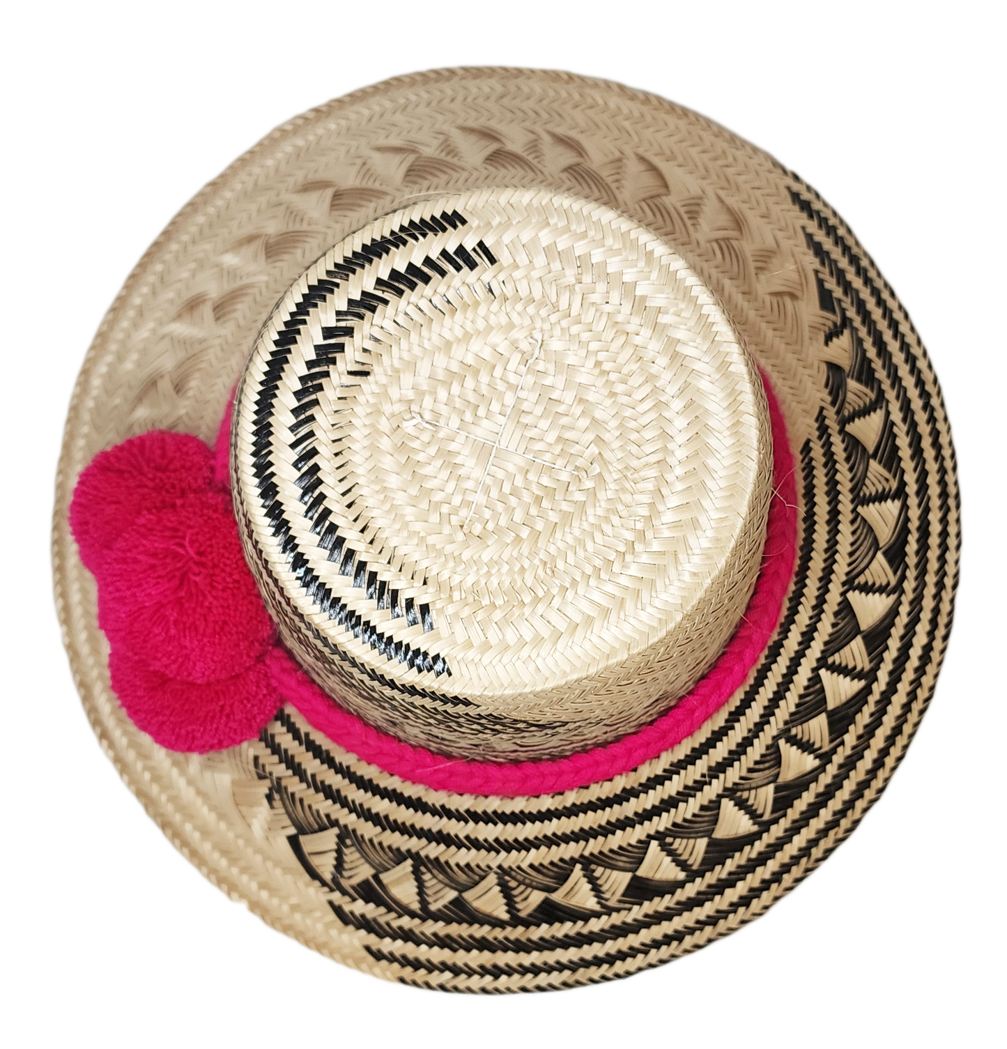 "Colorful handwoven Wayuu hat from Wuitusu, crafted with Iraca palm fibers and decorated with cultural pompoms."