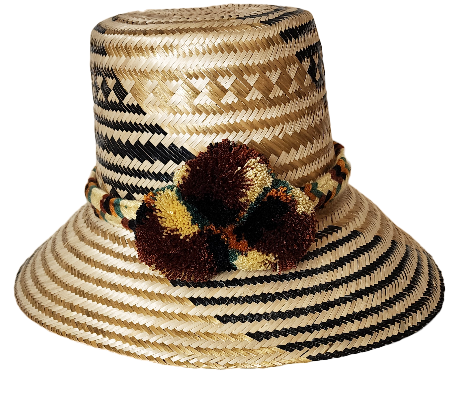 "Colorful handwoven Wayuu hat made from Iraca palm, adorned with cultural pompoms for prosperity, adjustable to fit all sizes