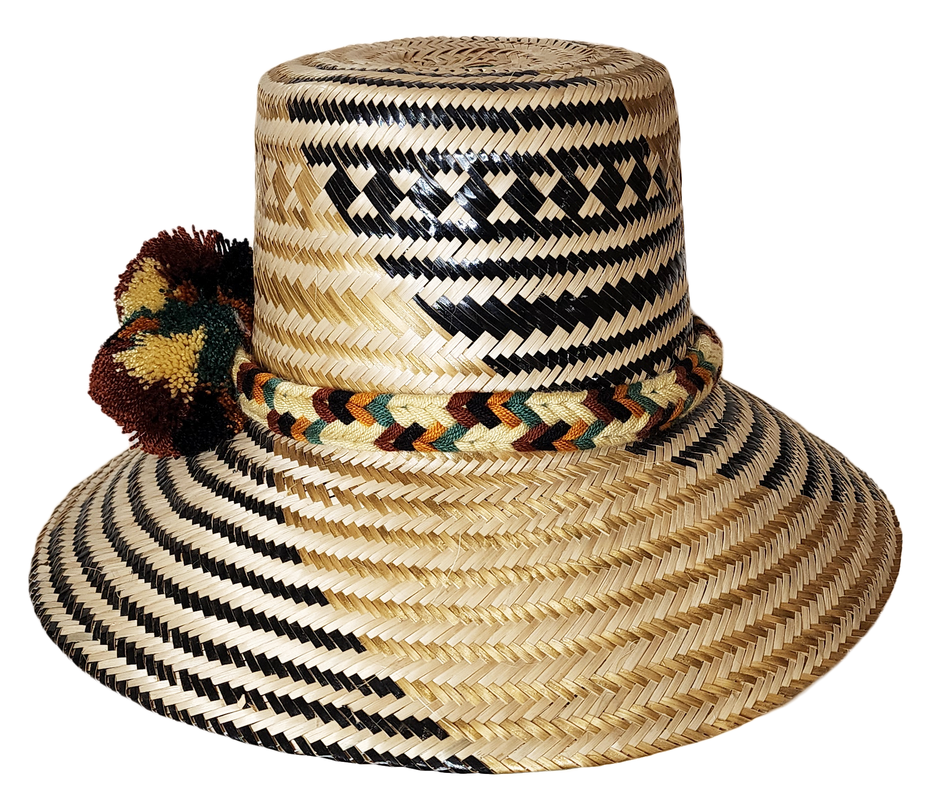 "Colorful handwoven Wayuu hat made from Iraca palm, adorned with cultural pompoms for prosperity, adjustable to fit all sizes