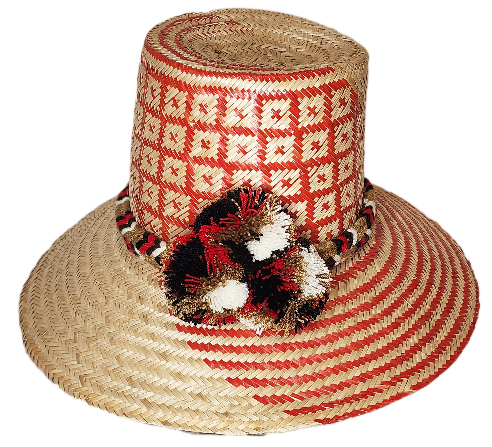 "Colorful handwoven Wayuu hat made from Iraca palm fibers, adorned with cultural pompoms, offering versatile and stylish sun 