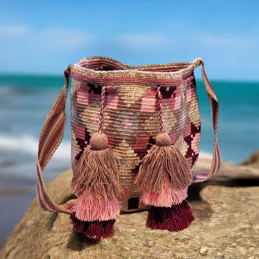 "Colorful Paleteada Crochet Wayuu Bag with metallic threads and adjustable handwoven straps, crafted by Colombian artisans."