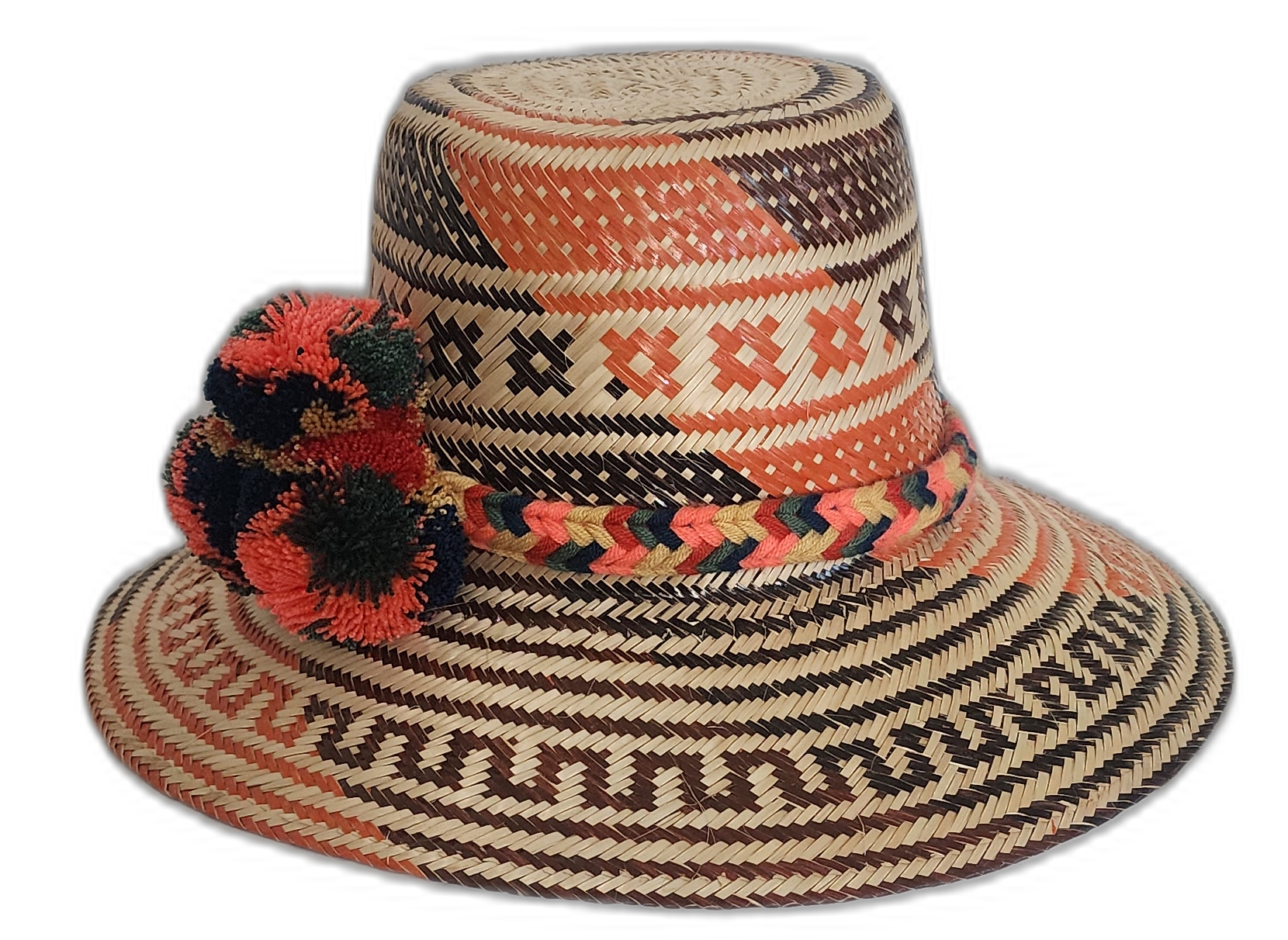 Artisan boho straw hat in natural straw with red and black patterns and colorful pompoms.