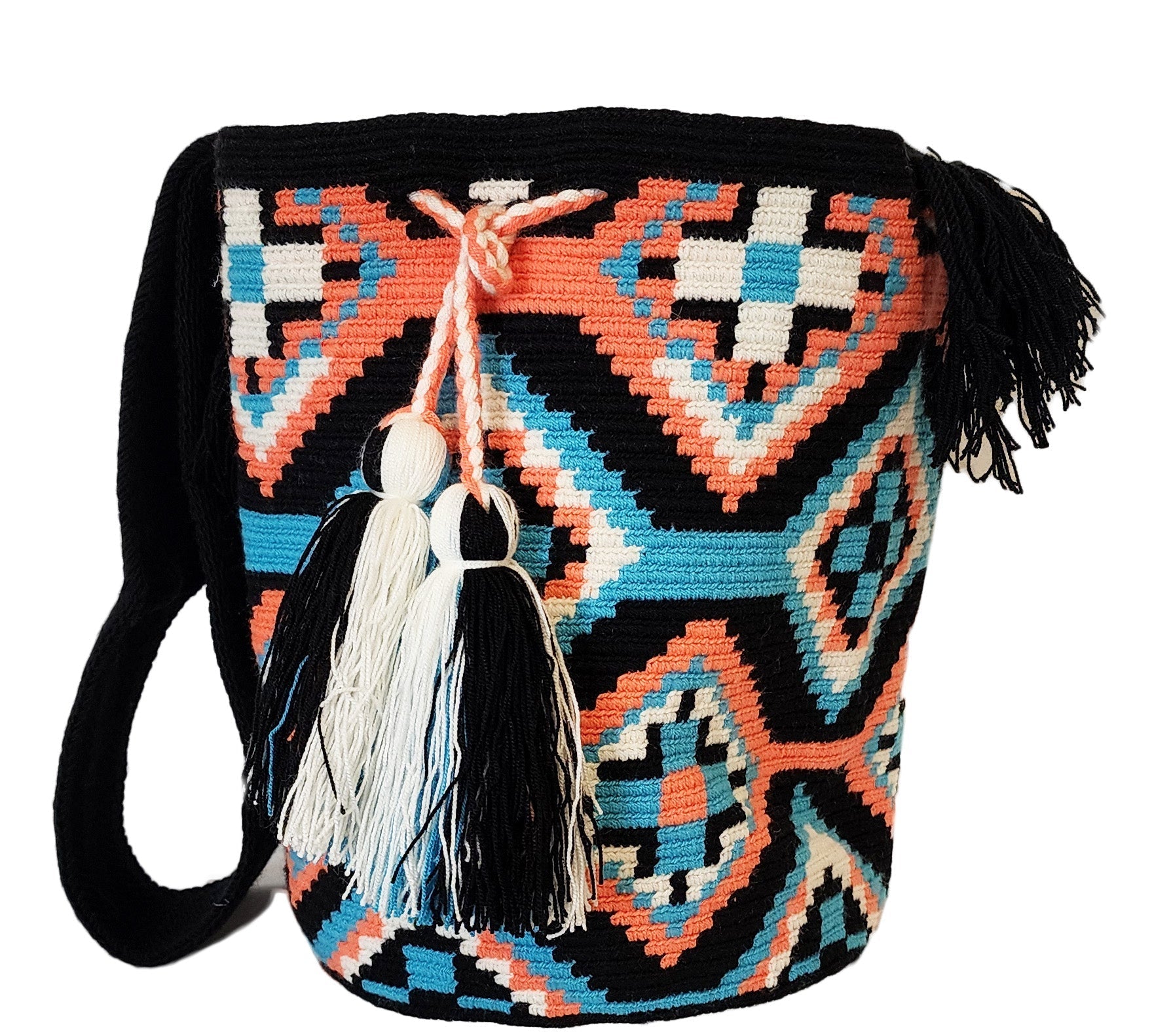 Bohemian crochet bag, handmade by Wayuu artisans, featuring black and coral weave, turquoise details, crossbody strap, and large tassels.