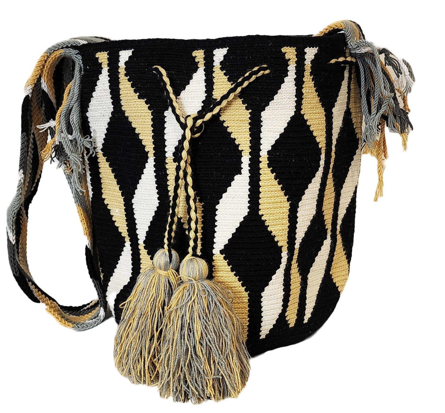 Bohemian crochet bag, handmade by Wayuu artisans, featuring black, tan, and white geometric waves, sturdy strap, and oversized tassels.