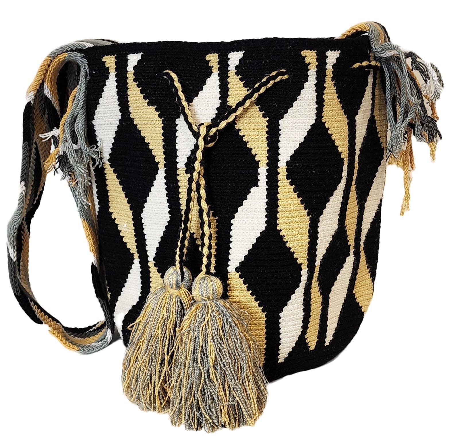 Bohemian crochet bag, handmade by Wayuu artisans, featuring black, tan, and white geometric waves, sturdy strap, and oversized tassels.