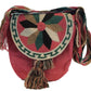 Bohemian crochet bag, handmade by Wayuu artisans, featuring coral body, floral lid design in green, black, tan, cream, and long tassels.