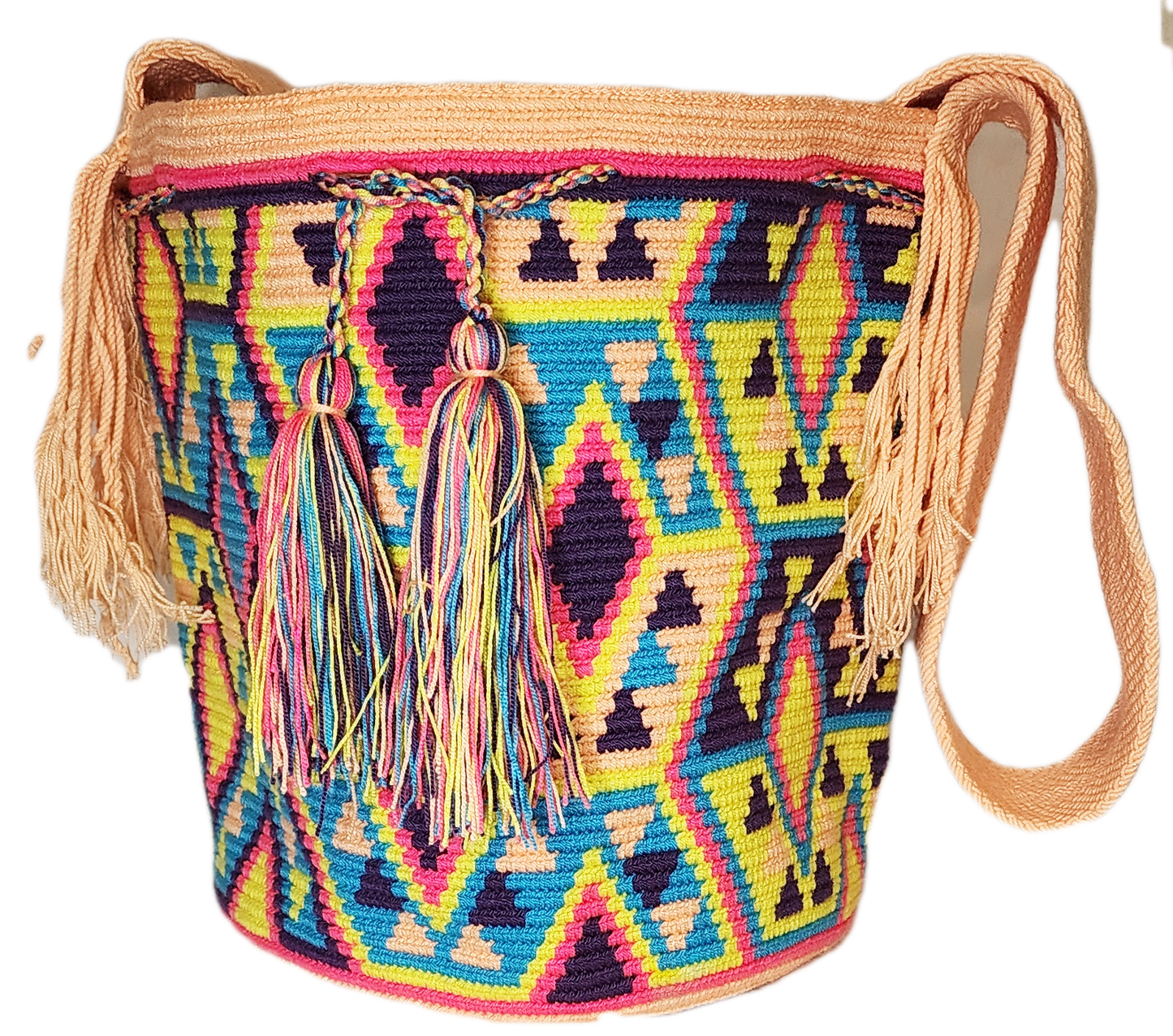 Vibrant bohemian crochet bag, handmade by Wayuu artisans, featuring multicolor geometric weave, tan edges, crossbody strap, and tassels.