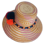 One-of-a-kind bohemian Wayuu straw hat with rich pink-orange tones and eye-catching accents.

