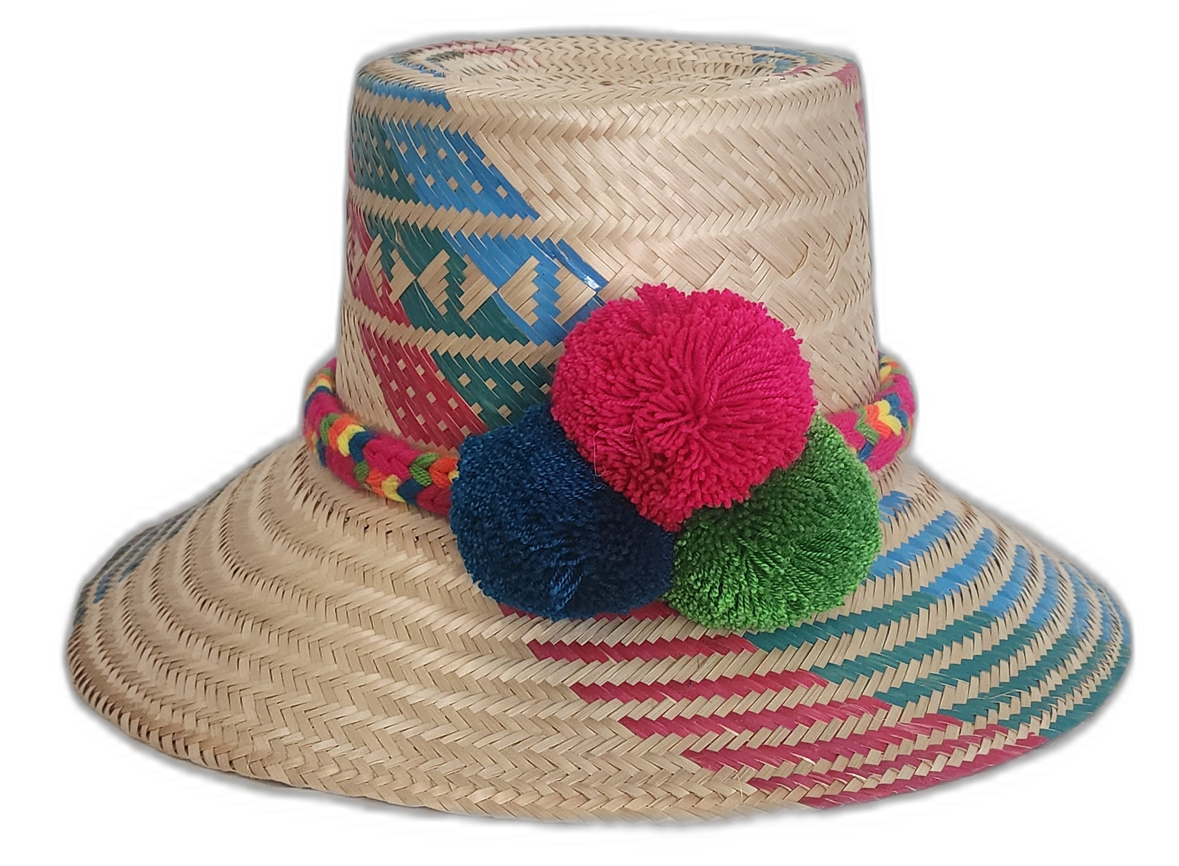 Handmade Wayuu straw hat with red, blue, and green pompoms and vibrant multicolor weave.

