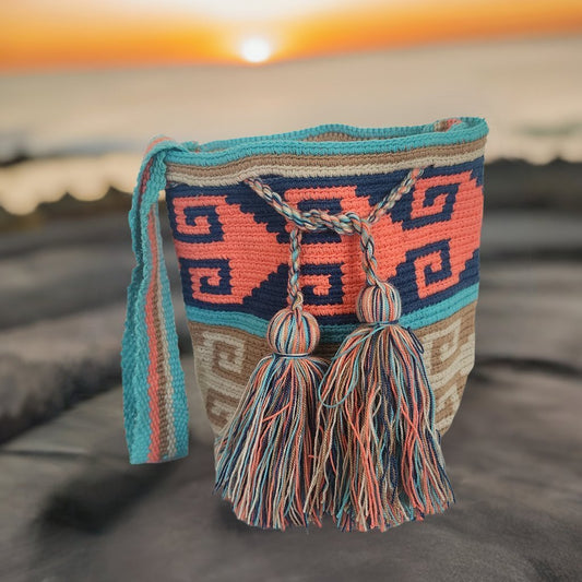 Handmade Wayuu crochet bag in coral, teal, and navy with tassels