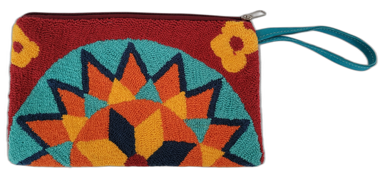 Handmade boho chick clutch with bold geometric embroidery and teal wristlet strap


