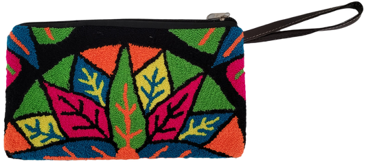 Bright and colorful punch needle Wayuu clutch with vibrant leaves and geometric patterns in green, orange, pink, blue, yellow, and black — handmade and artisan-crafted.
