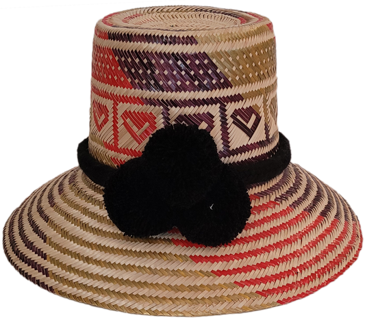 Colorful handmade straw hat with geometric heart patterns and black pompoms