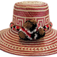 "Colorful Wayuu hat, handwoven from Iraca palm fibers by artisans, adorned with meaningful pompoms for style and cultural sig
