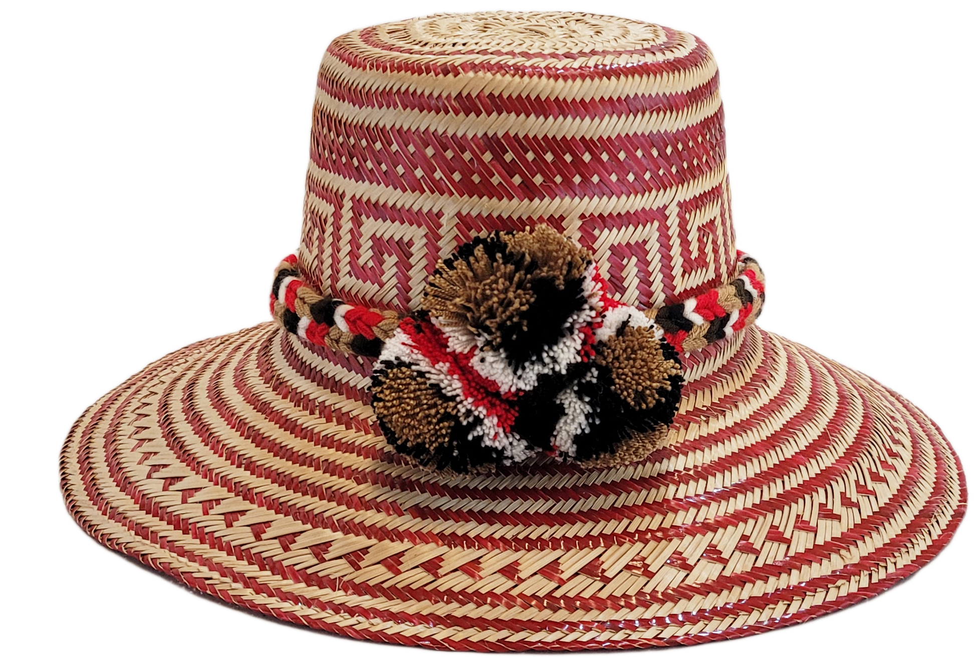 "Colorful Wayuu hat, handwoven from Iraca palm fibers by artisans, adorned with meaningful pompoms for style and cultural sig