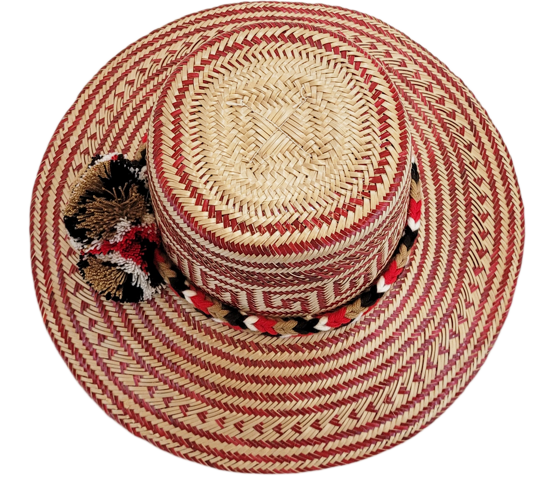 "Colorful Wayuu hat, handwoven from Iraca palm fibers by artisans, adorned with meaningful pompoms for style and cultural sig