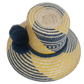 Boho Wayuu hat with wide brim, navy and yellow color pattern, and fluffy pompoms