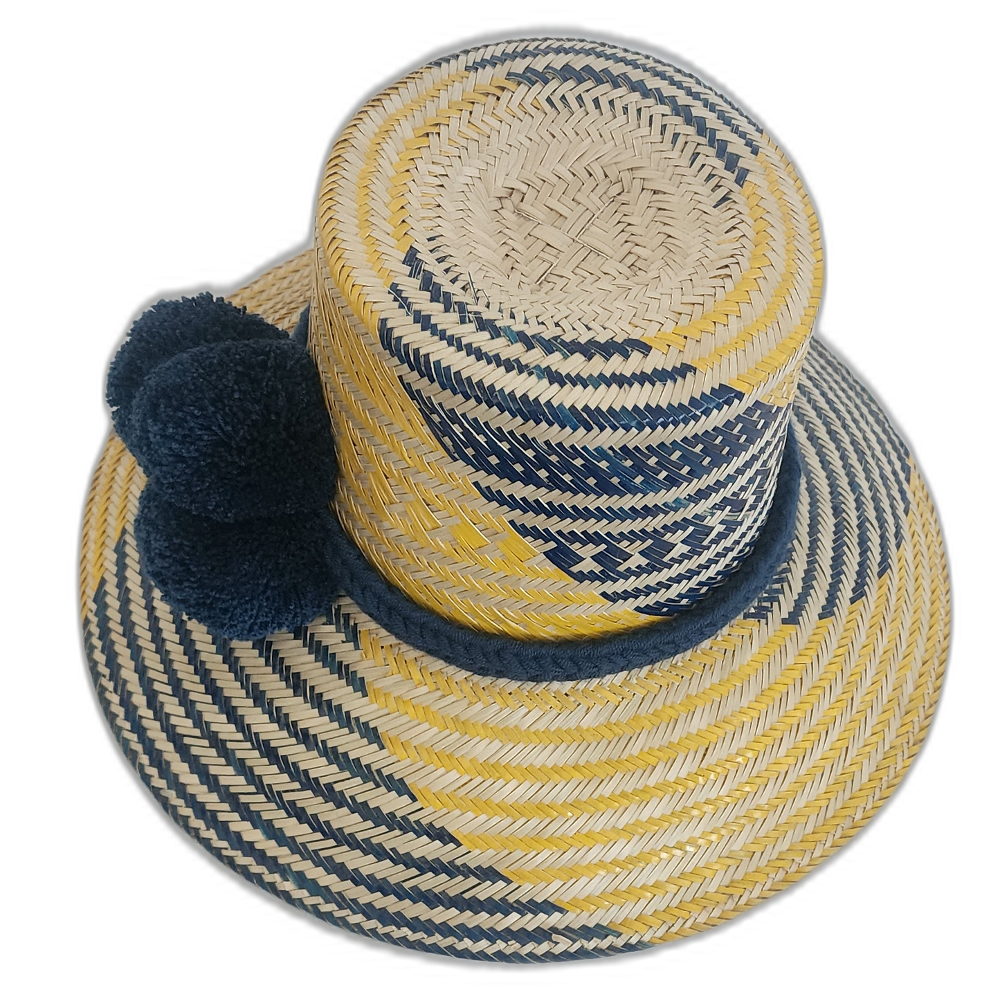 Boho Wayuu hat with wide brim, navy and yellow color pattern, and fluffy pompoms