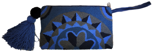 "Colorful Wuitusu Artisan Needle Punch Clutch handcrafted by Wayuu artisans, featuring intricate patterns and a zippered clos