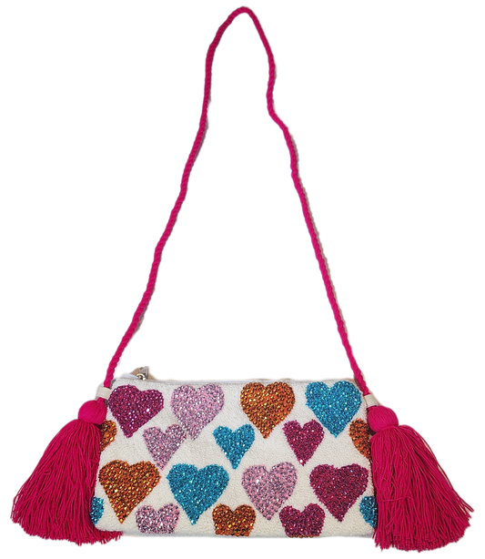 "Colorful Wuitusu clutch, artisan-crafted with crochet patterns and crystal embellishments, supporting Wayuu culture."