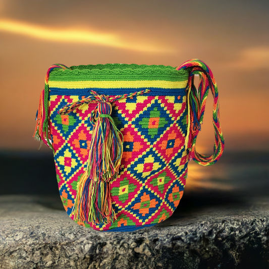 "Colorful Wuitusu Wayuu crochet bag featuring geometric patterns and adjustable strap, embodying bohemian charm and cultural 