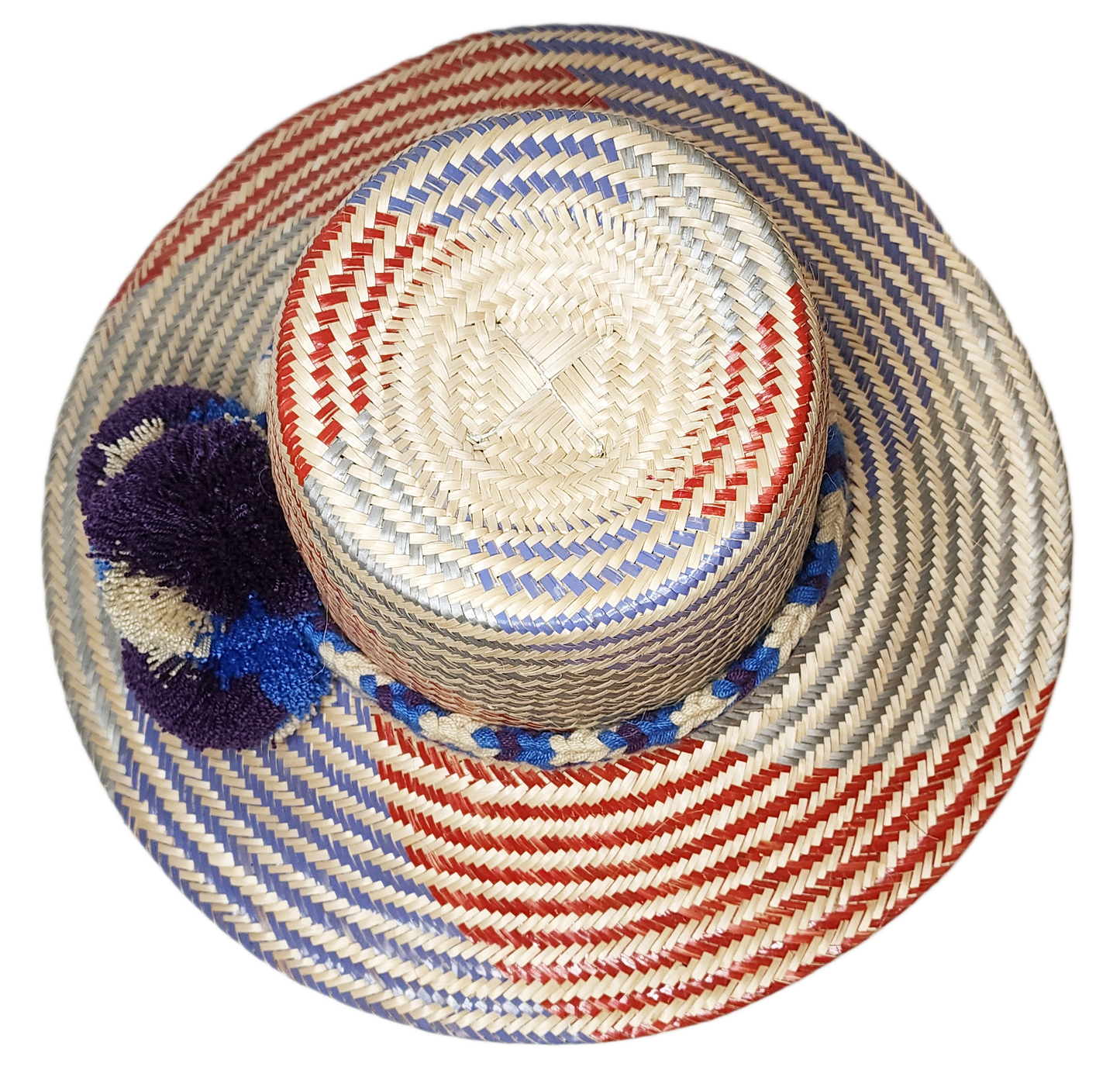 "Colorful Wuitusu Wayuu hat crafted from Iraca palm fibers, adorned with significant pompoms, versatile and adjustable fit."