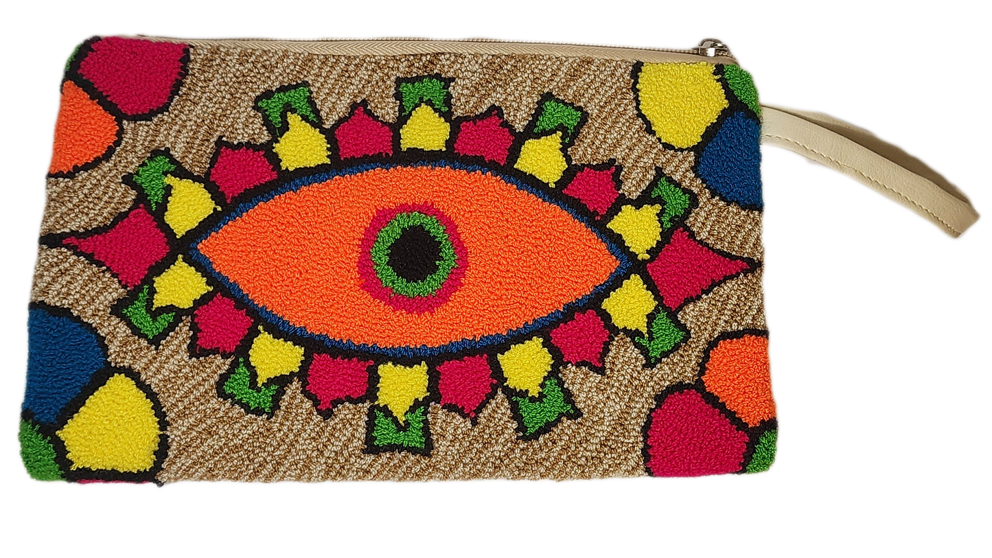 "Colorful Wuitusu Wayuu Needle Punch Clutch, handmade with vibrant needle punch patterns by Wayuu artisans, featuring a secur