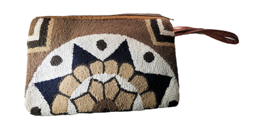 "Colorful Wuitusu Wayuu Needle Punch Clutch, handmade with vibrant, intricate patterns by skilled artisans, featuring a secur