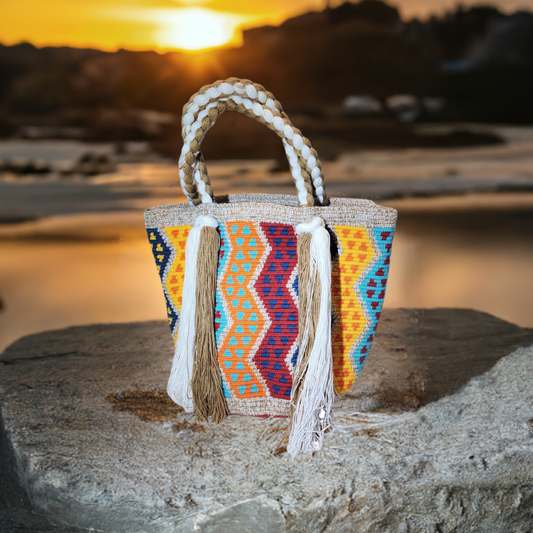 "Colorful Wuitusu Wayuu Waterfall Purse with cascading thread design, handcrafted by Wayuu artisans, showcasing vibrant patte