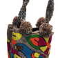 Vibrant bohemian Wayuu crochet bag with tropical bird and colorful flowers