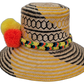 Artisan Wayuu hat Daniela with yellow geometric weave and bright orange, black, and yellow pompoms

