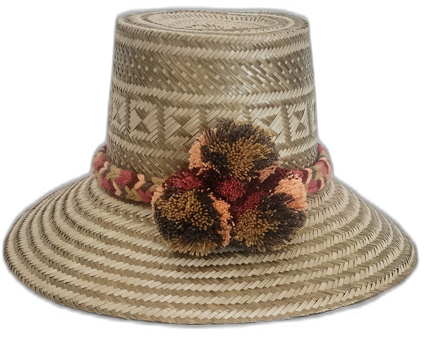 Handmade Wayuu straw hat in earthy tones with brown and orange pompoms