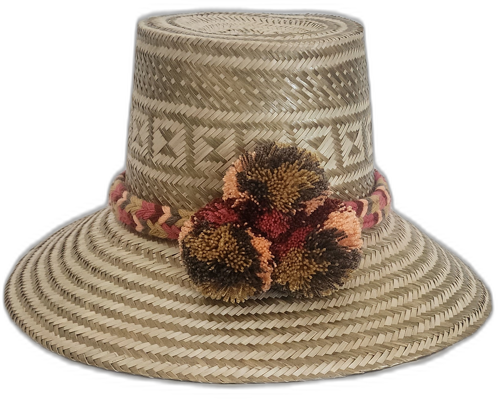 Handmade Wayuu straw hat in earthy tones with brown and orange pompoms