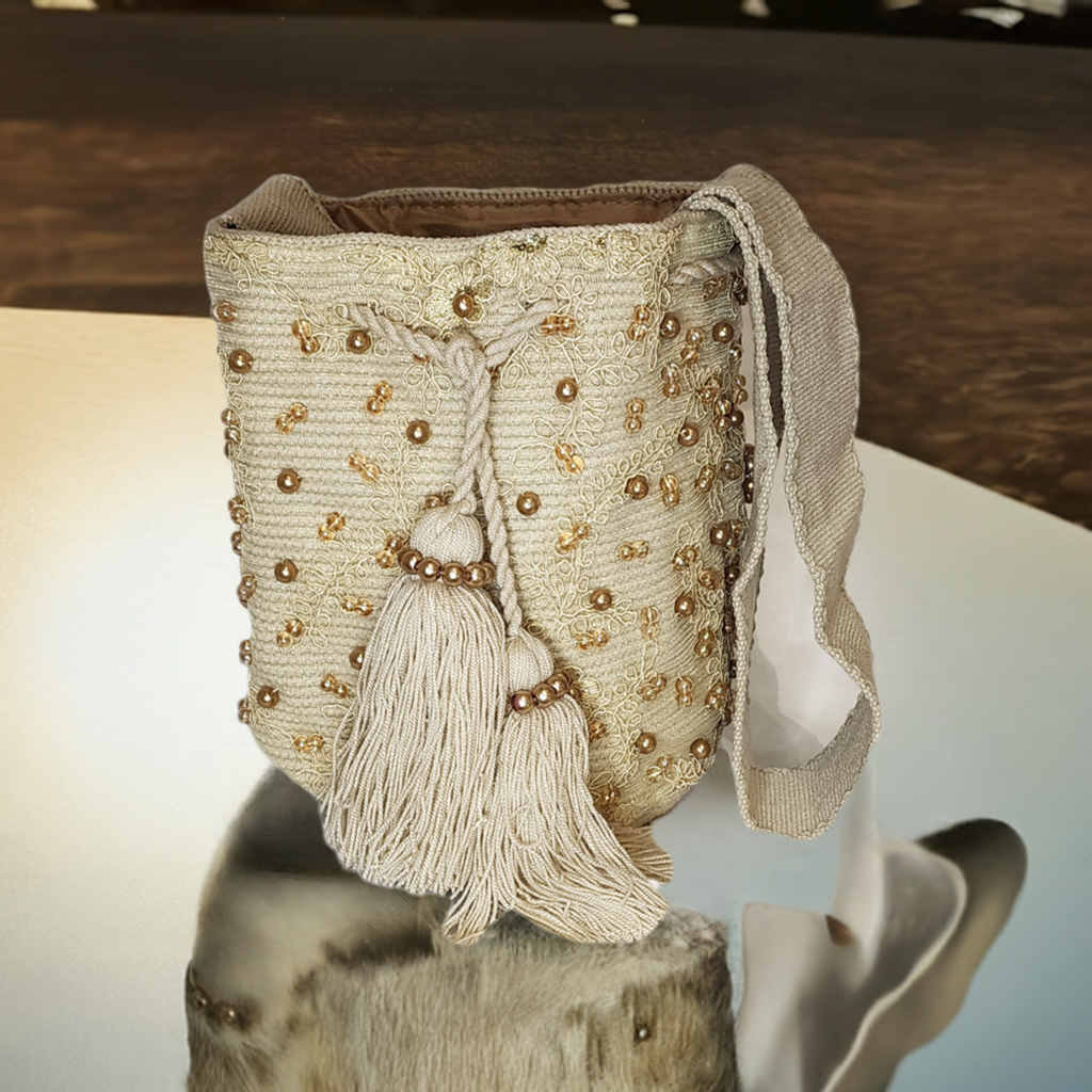 Bottom view Elegant cream crochet Wayuu bag with pearl-like beads and artisan craftsmanship.