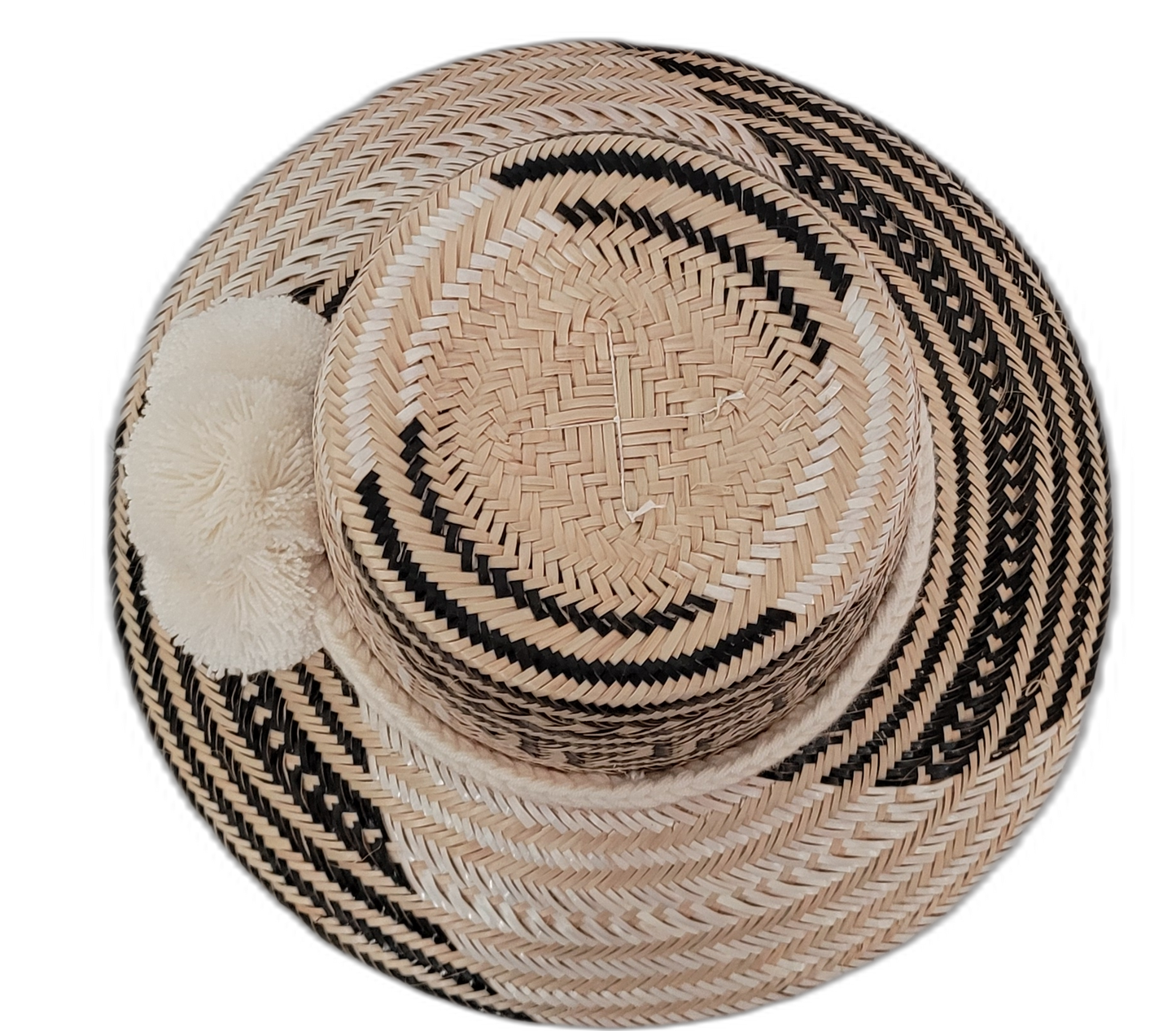 Elisa handmade bohemian hat with striking black and natural pattern and white pompoms

