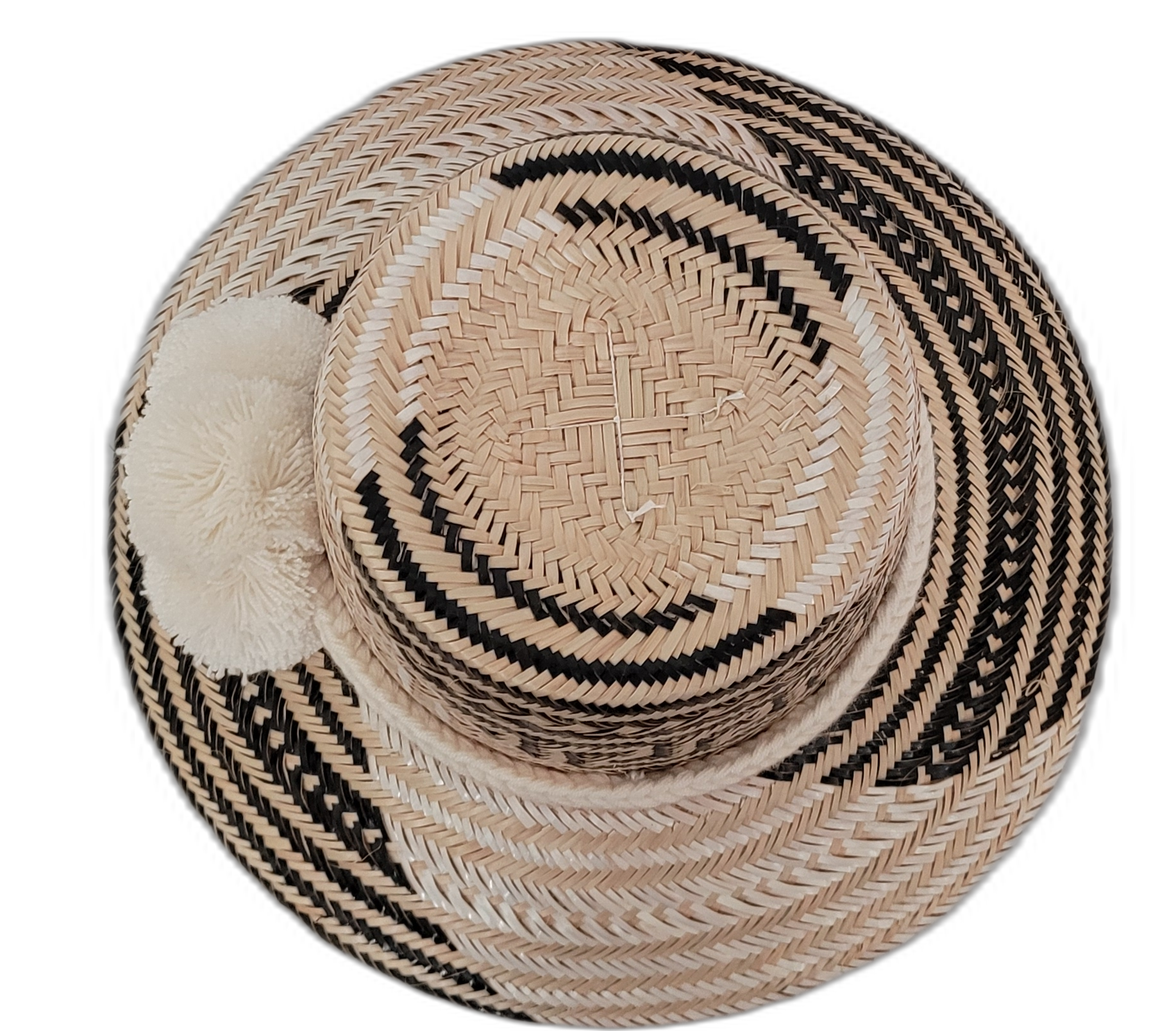 Elisa handmade bohemian hat with striking black and natural pattern and white pompoms

