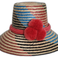 Handmade Wayuu straw hat with red, blue, and black weave and red pompoms.Natural straw bohemian hat with colorful pink crown band and artisan design

