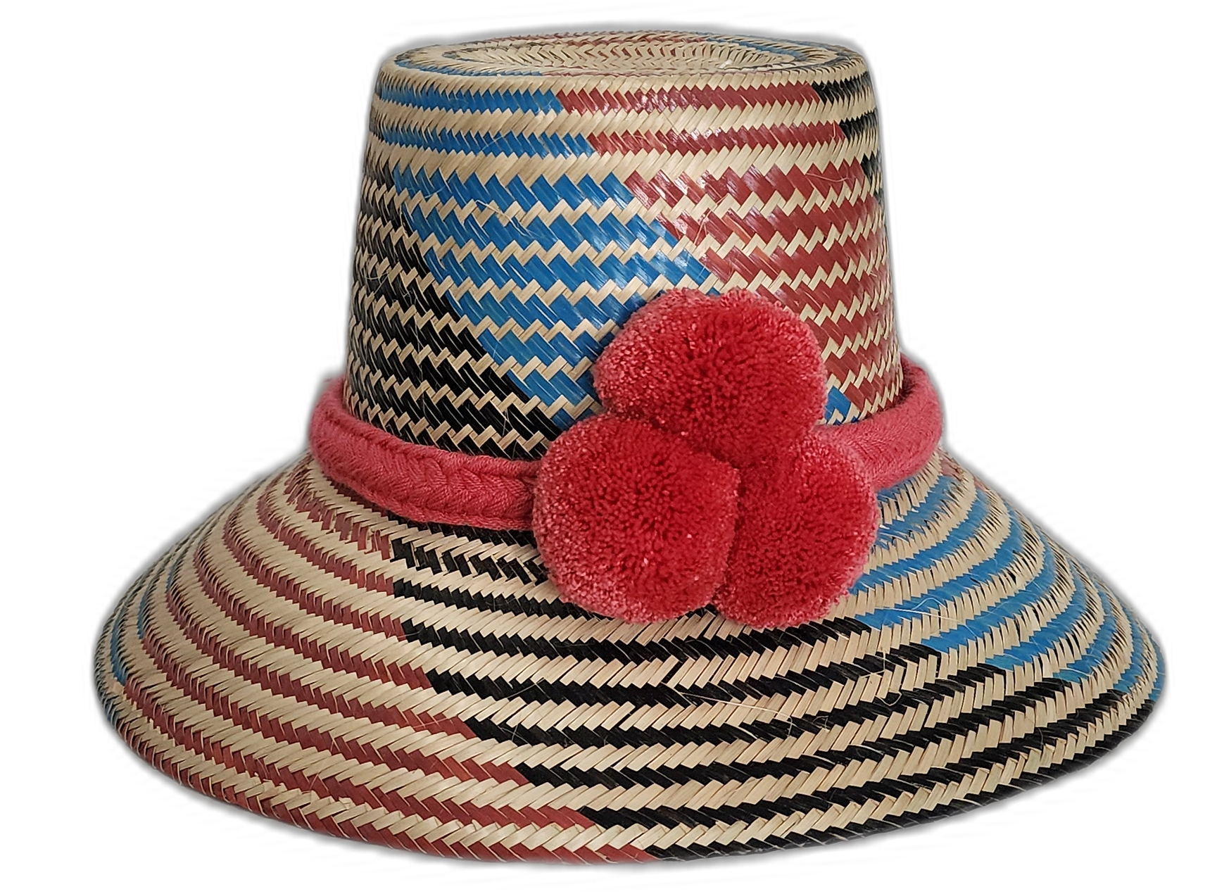 Handmade Wayuu straw hat with red, blue, and black weave and red pompoms.Natural straw bohemian hat with colorful pink crown band and artisan design

