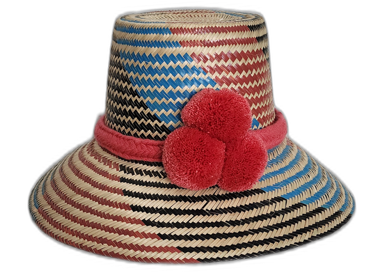 Handmade Wayuu straw hat with red, blue, and black weave and red pompoms.Natural straw bohemian hat with colorful pink crown band and artisan design

